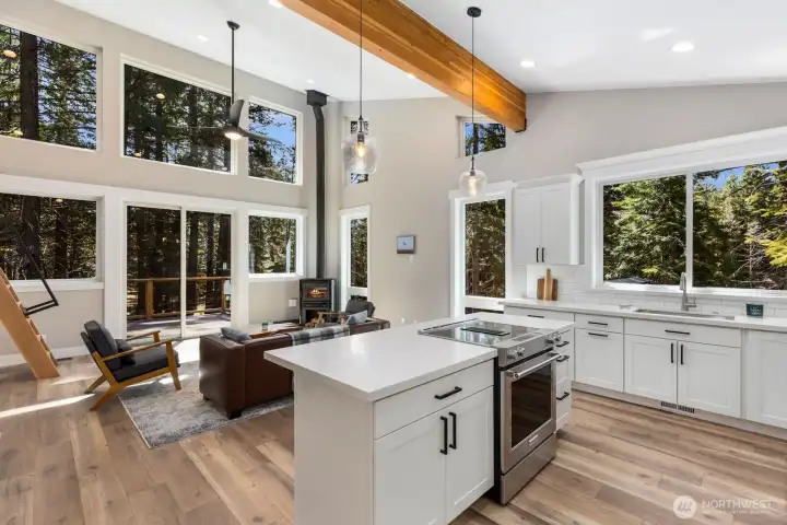 Expansive windows invite abundant natural light throughout.