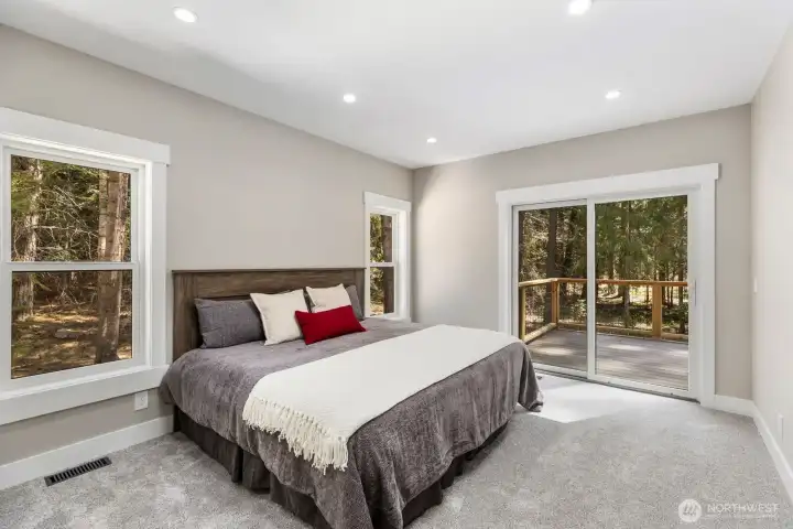 Primary suite with direct access to the deck.