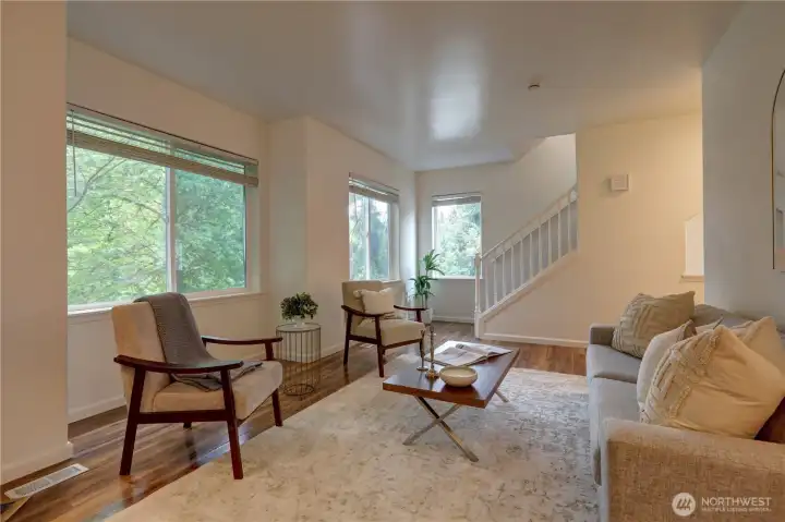 Expansive windows fill the room with sunlight.