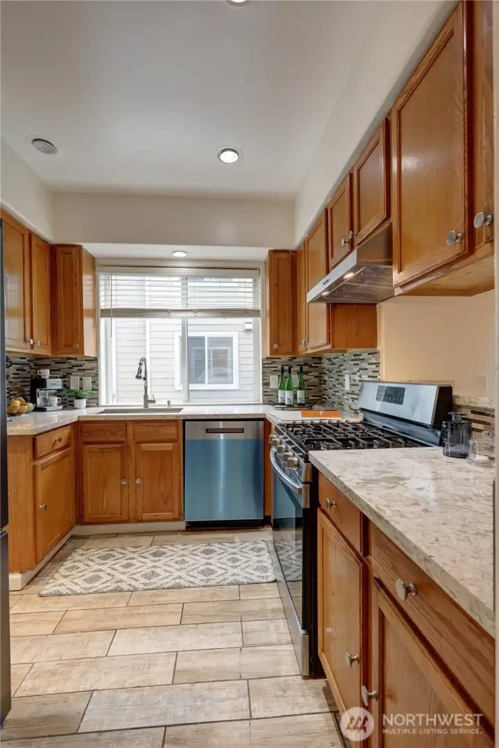 Well-appointed kitchen designed for functionality with a gas cooktop for precision cooking.