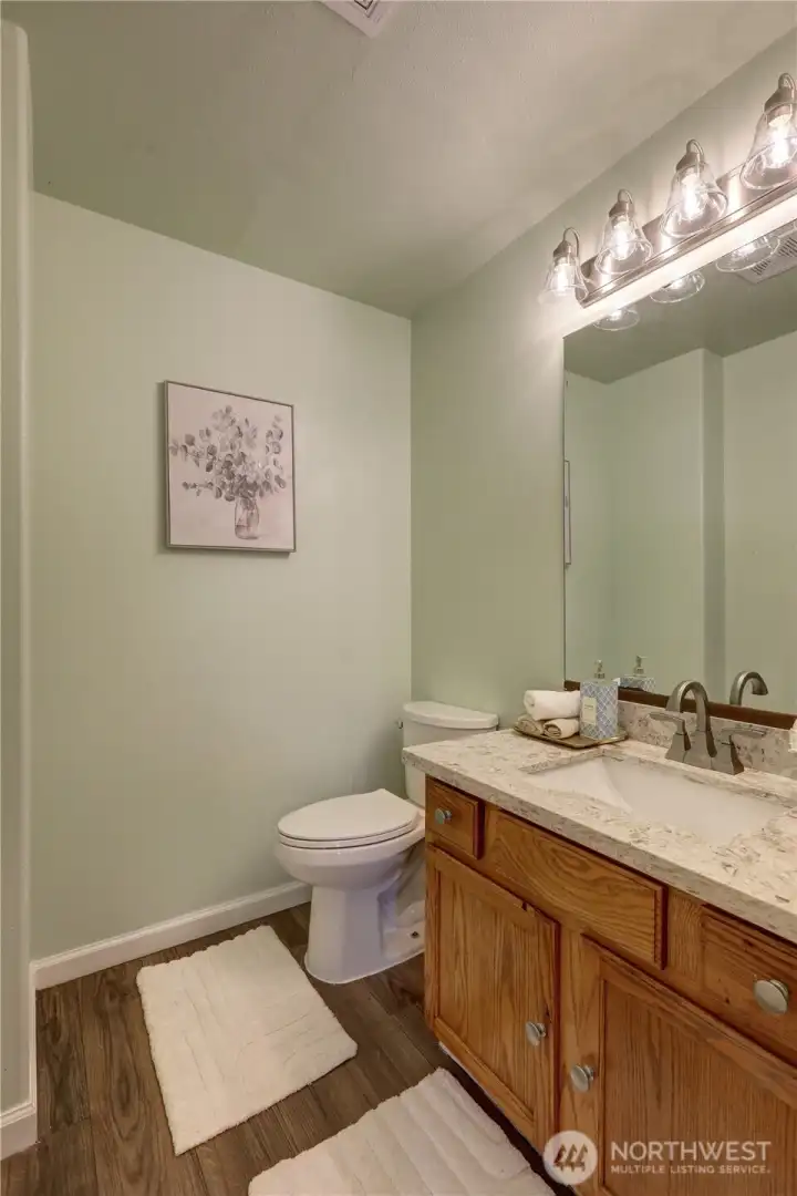 Dual-sink vanity in the primary bath provides convenience and functionality.