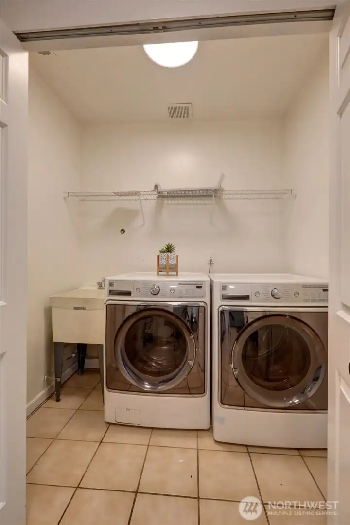 Dedicated laundry room adds convenience.