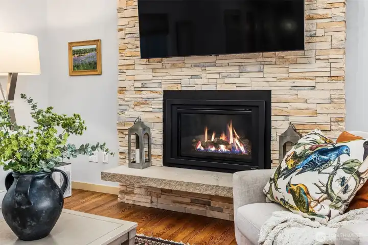 This gorgeous, floor to ceiling stacked stone fireplace and hearth are part of the home's recent updates. This gorgeous, floor to ceiling stacked stone fireplace and hearth are part of the home's recent updates.
