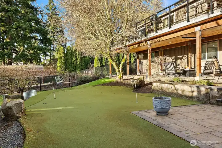 This 60 foot putting turf is sure to keep your game sharp! All the yard and planters have irrigation. This 60 foot putting turf is sure to keep your game sharp! All the yard and planters have irrigation.