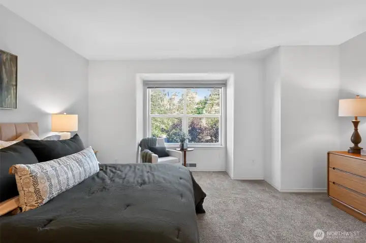 Watch the sunset over the Olympics from your primary suite.