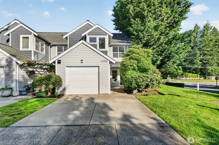 Attached garage with additional driveway parking