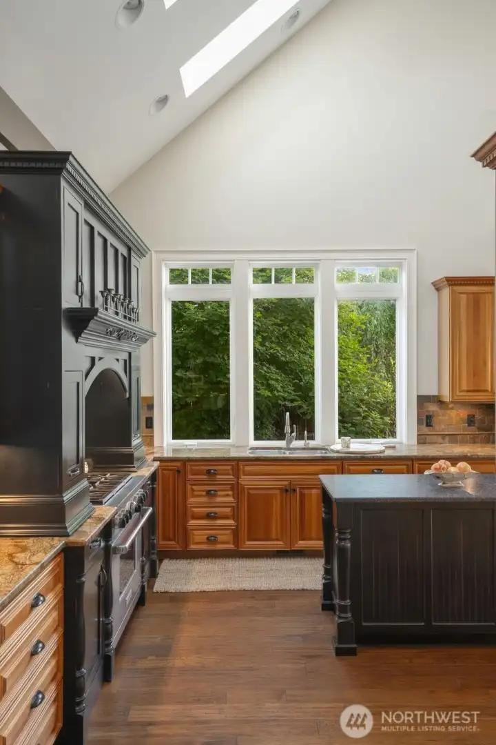 Kitchen with vaulted ceiling, skylights & view of the Blues