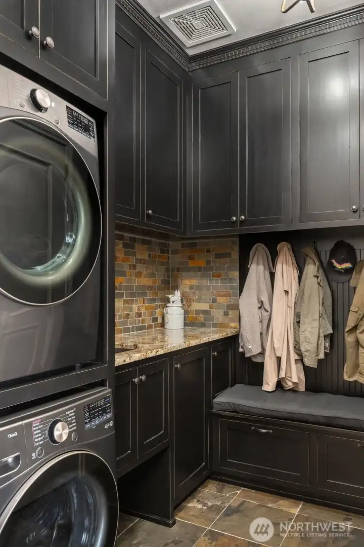 Laundry room with utility sink and storage