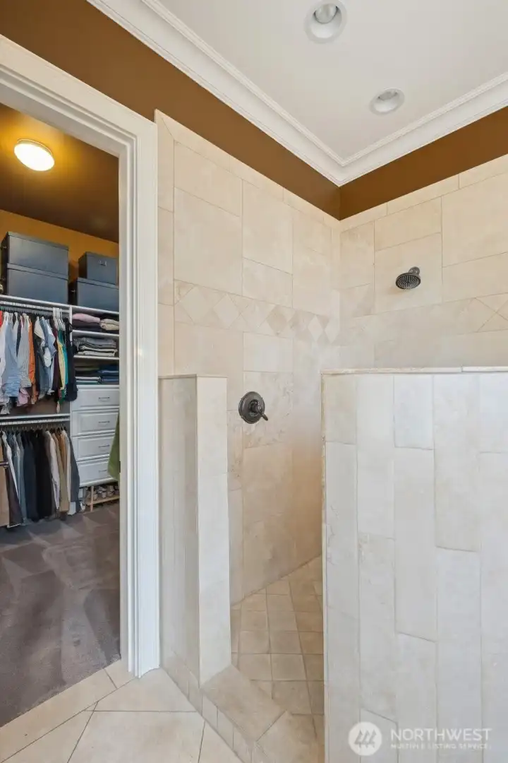 Primary ensuite walk-in shower and closet