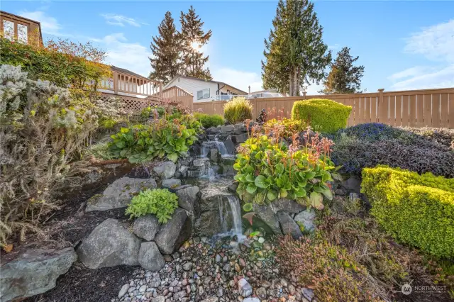 Water feature with beautiful landscaping.