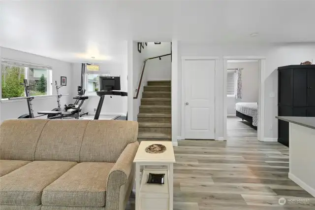 Entrance level space has room for the work out station, TV area, a bedroom/flex space and full bath. Great area for guests or owners.