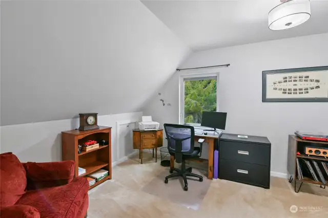 Office/flex space on the top floor at back of the home overlooking the pretty yard.