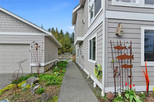 Sidewalk from the parking area to the rear of the home.