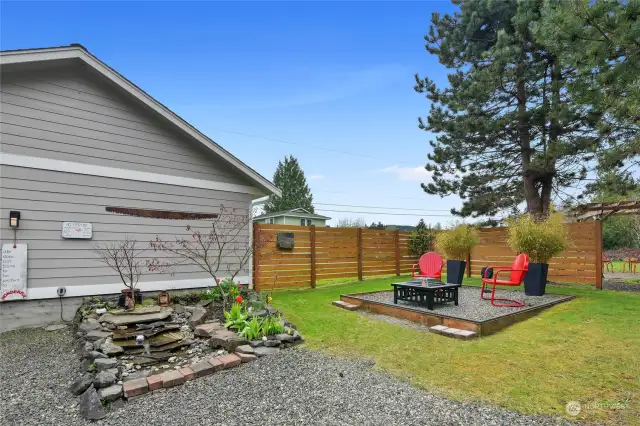 Fire pit area and a water feature.