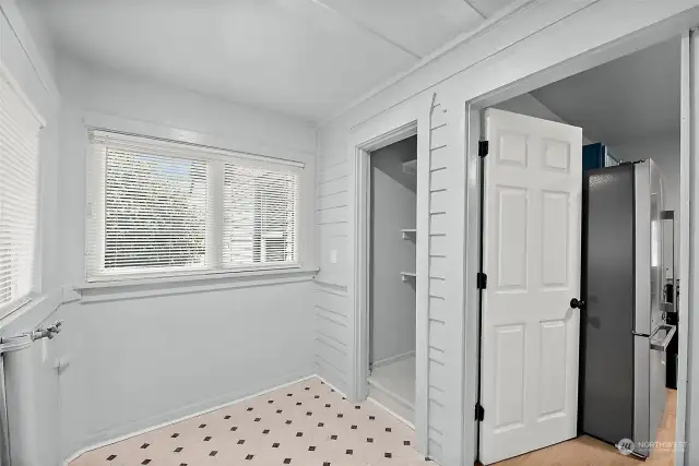 Utility/mud room with storage.