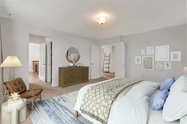 Primary bedroom with double doors to the stairs and loft