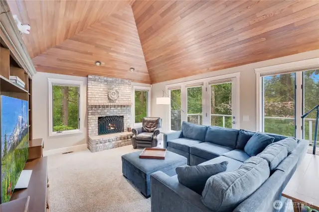Family room off the kitchen with warm fireplace