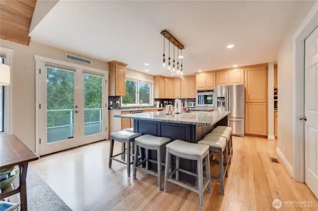 Remodeled kitchen with granite counters and stainless appliance package