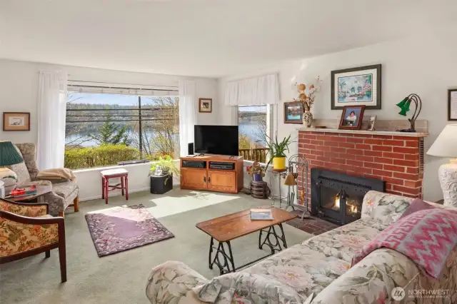 Living Room with Wood Fireplace and Lake View