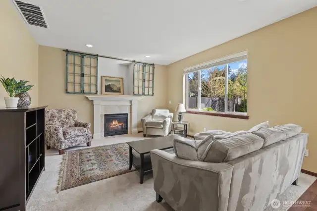 Family room - sliding wall art can be left if buyer wishes