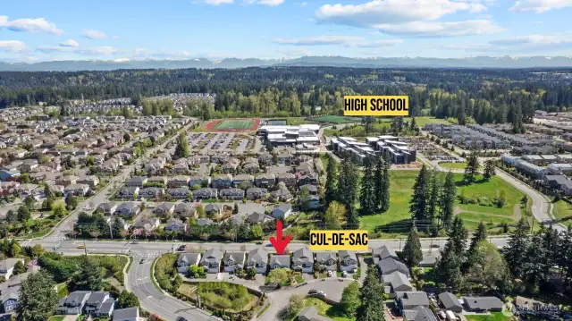 Drone photo of house - home located in a cul-de-sac community near local high school