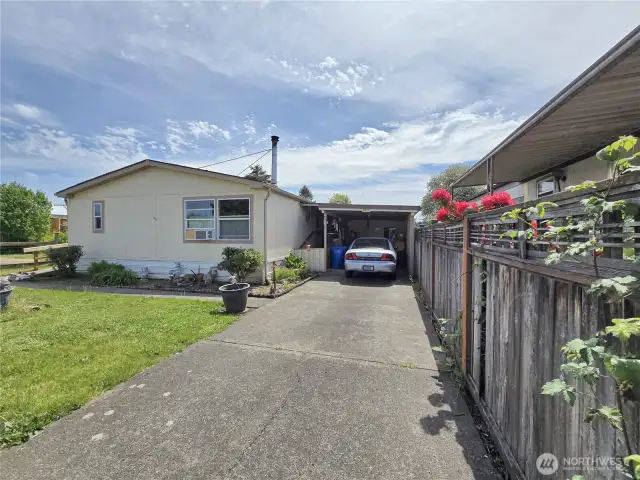 Concrete driveway and carport has a storage shed that's available to you which is so convenient with easy access to the house.
