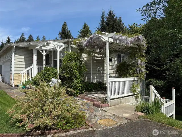 This is a very unique property with primary bedroom on main level and 2 bedrooms, another full bath, more storage and a large bonus room in the daylight basement as well as a sliding door and deck.
