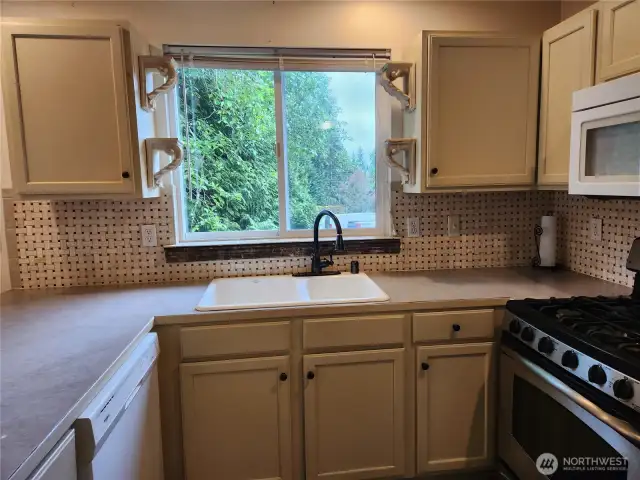 Note basket weave custom tile backsplash.