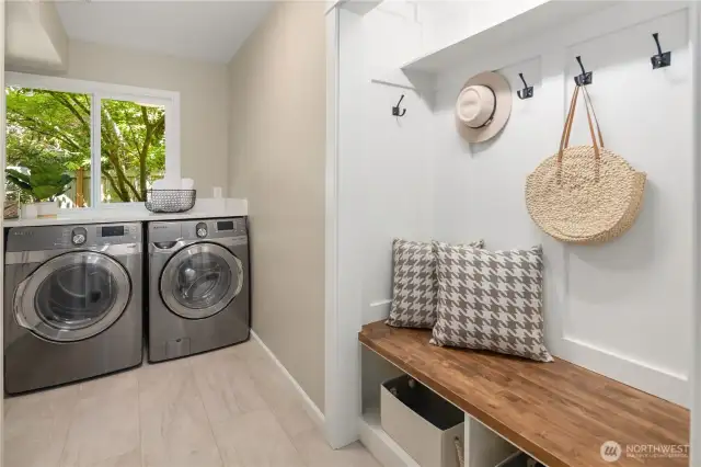 New landing area in the upgraded mud room. Custom stained solid oak butcher clock, classic shaker surrounding with hooks and under seat storage. Perfect for handling those wet Pacific Northwest days.