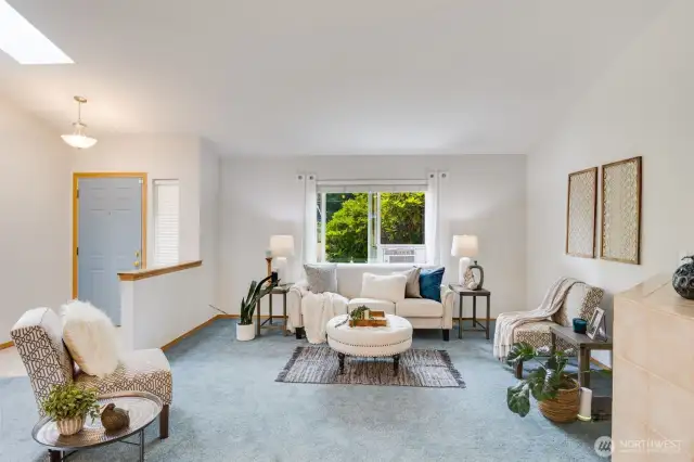 The main living space shines with brand new paint and recent carpet.