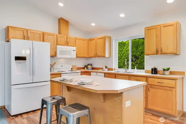 Inviting kitchen with much counter space awaits the chef of the home.