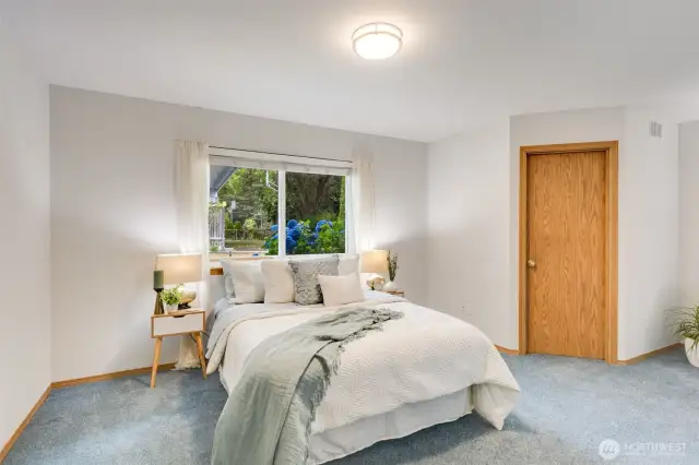 The large primary suite contains a walk in closet and en-suite bathroom.