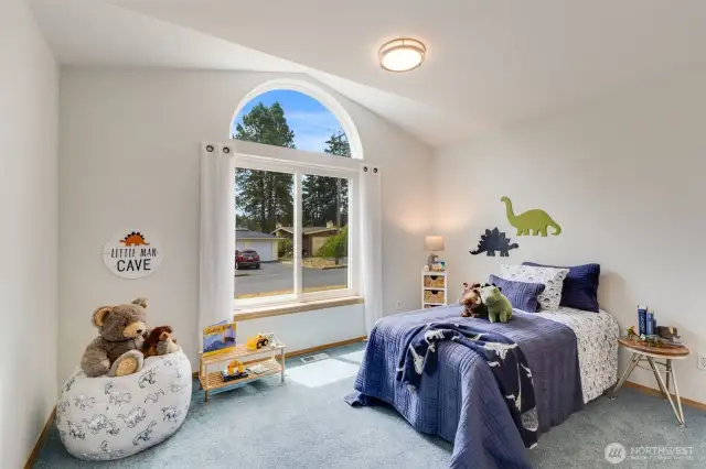 The second bedroom has charming vaulted ceilings and lots of natural light.