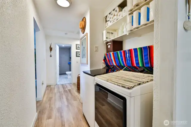 Hallway leading to bedrooms and fully remodeled bathroom