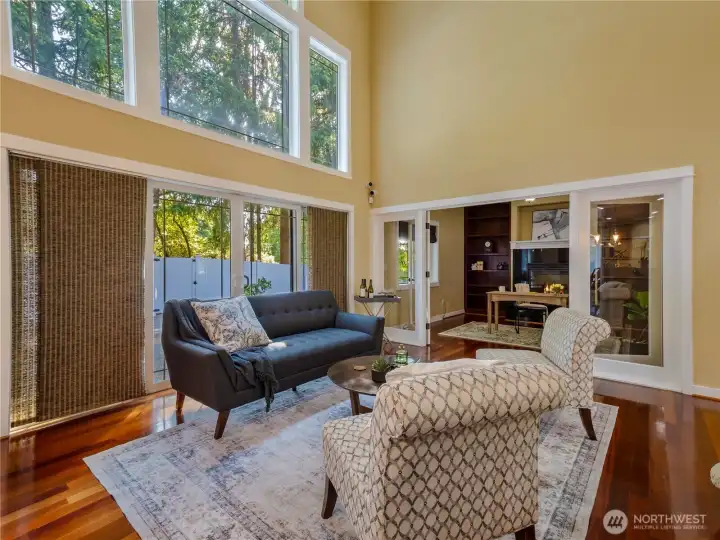 Beautiful windows let in the natural light and showcase the greenery of the surrounding trees.