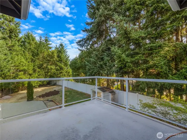 The balcony off the primary bedroom is the perfect spot to sit and enjoy the outdoors...relax, reflect, rejuvenate!