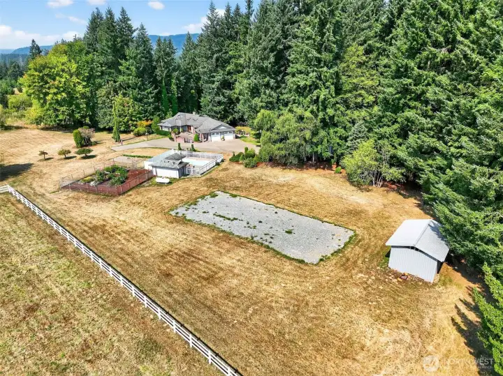 Set on 11+ acres, this home offers a fenced garden and a convenient flat gravel area for RV parking.