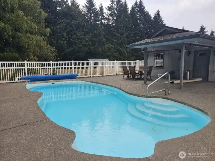 Relax by the in-ground pool, complemented by a poolside changing room and bathroom.”