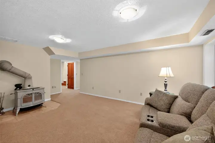 Lower level features complete apartment type living. 2 Bedrooms and Bathroom. Wood Stove