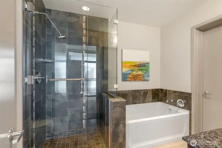Gorgeous tiled shower and deep soaking tub.