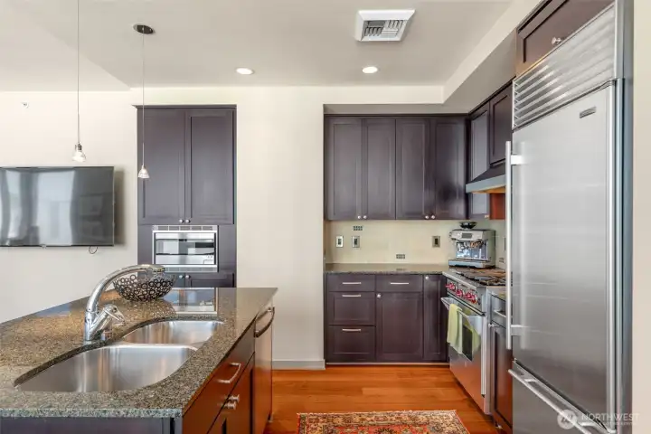 Lots of counter and cabinet storage space in this kitchen.
