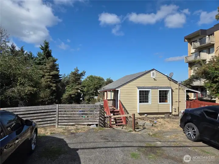 Newer siding and roof. Two separate entrances for the upstairs unit.