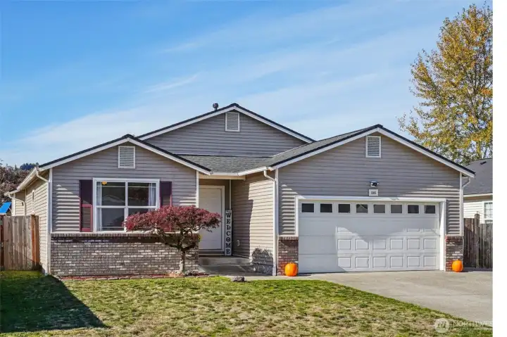 Charming home with great street appeal and RV parking behind the fence.