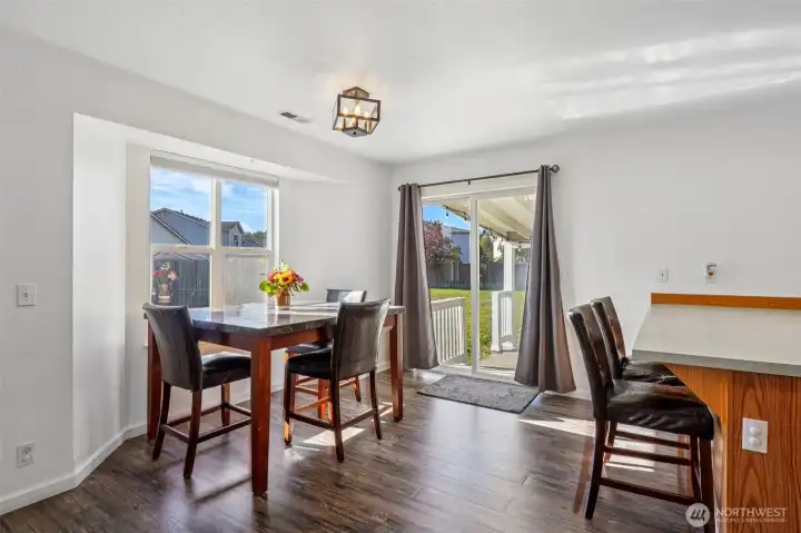 Dining room with picture window frames Mt Rainier on a clear day.
