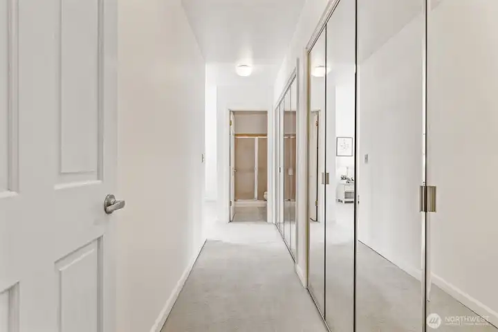 Wall of closets in primary bedroom