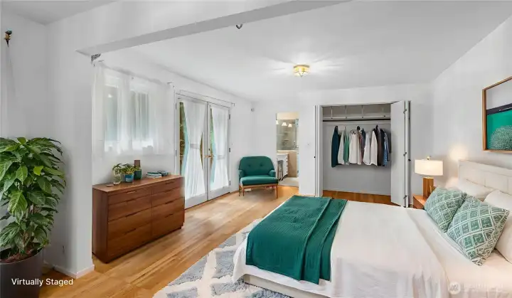 Primary Bedroom has plenty of space for all your needs and access to the deck.