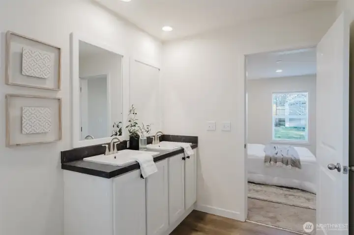 En suite bathroom to primary bedroom