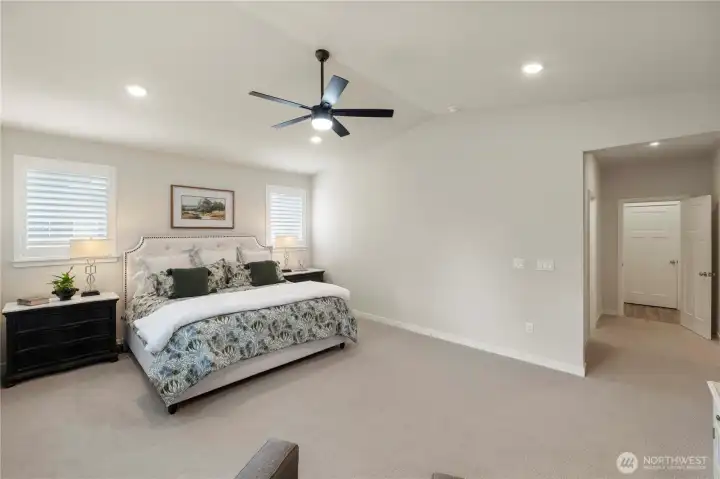 Luxurious primary suite with walk-in closet