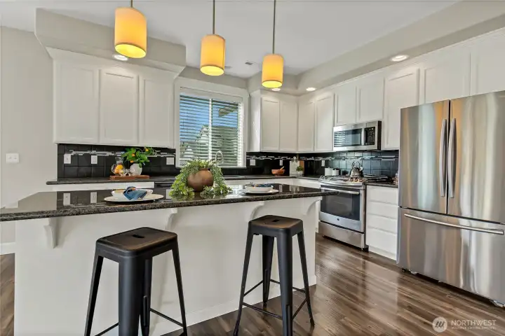 Granite counters, large island and ample cabinet space.