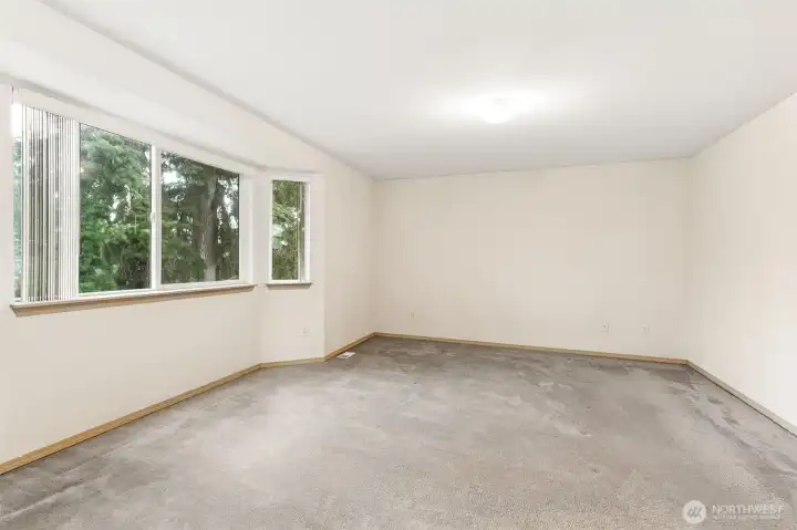 primary bedroom w full bathroom shower and soaking tub